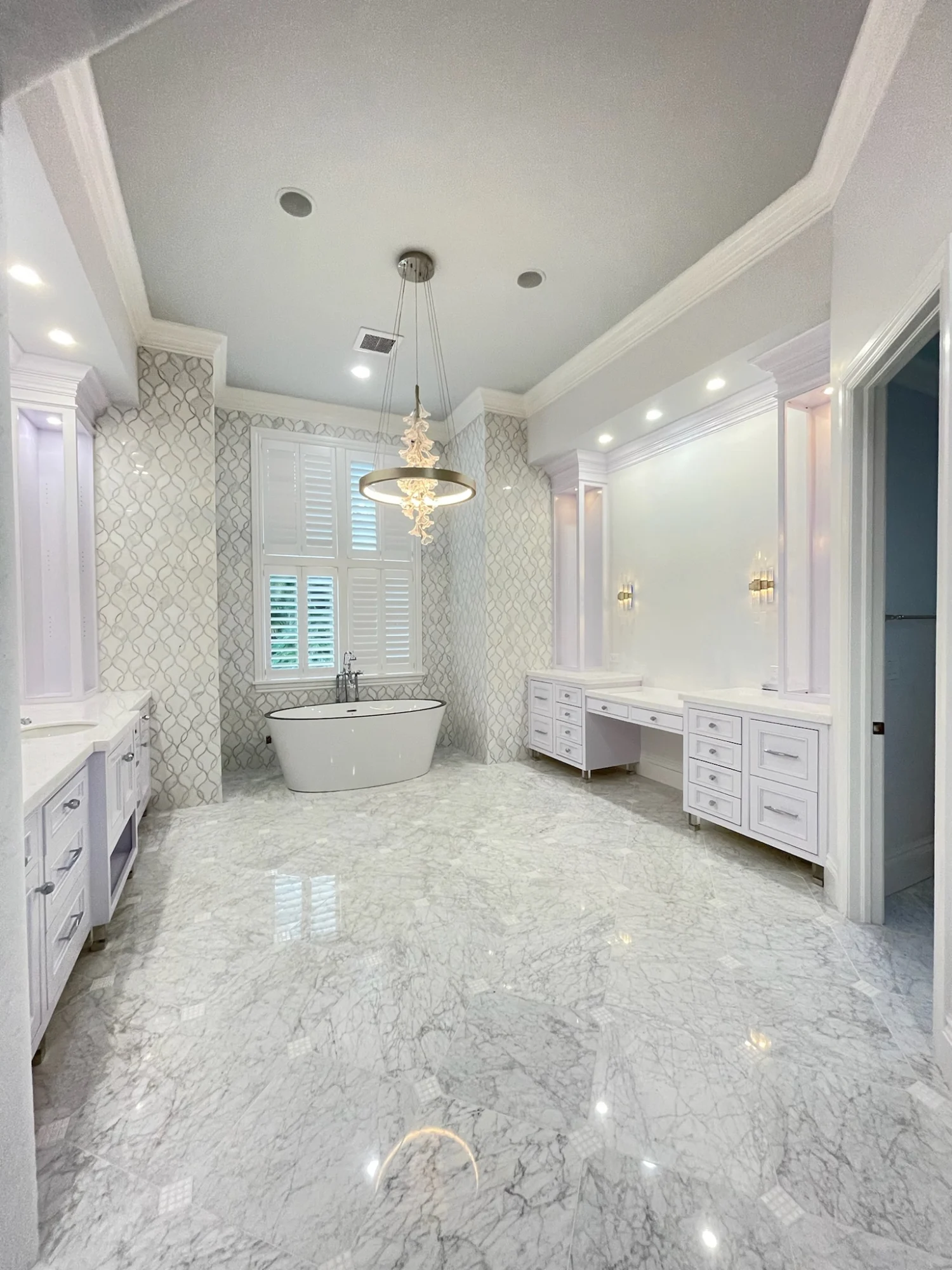 Luxury bathroom renovation with custom vanities