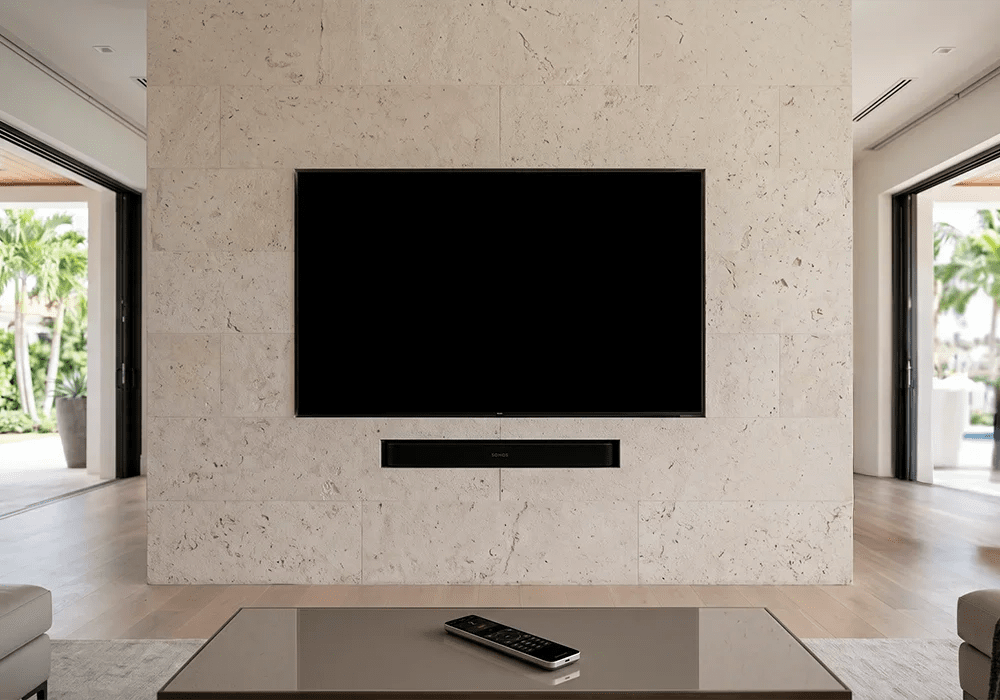 Luminary home entertainment installation with wall-mounted television and soundbar