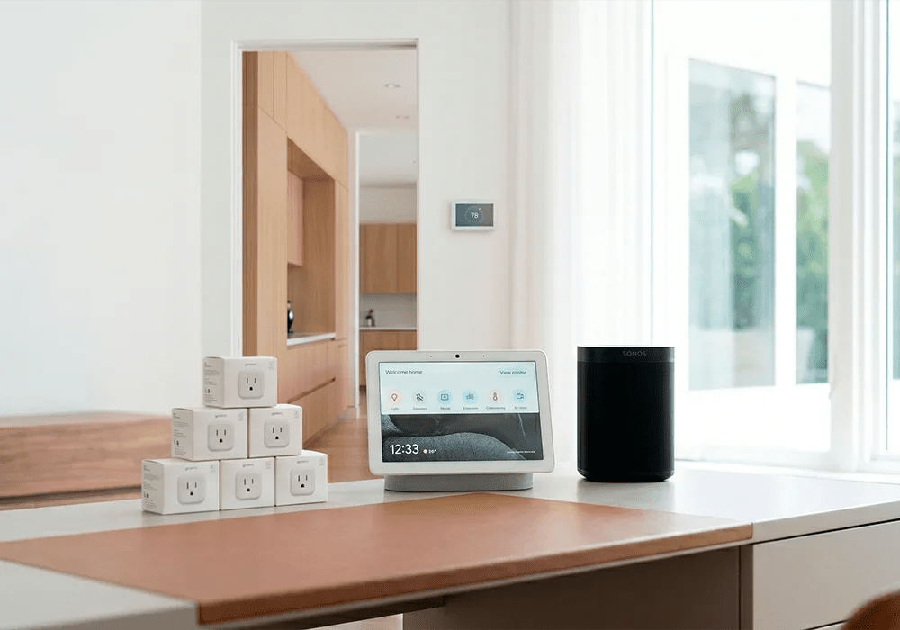 Smart home display, speaker and connected devices installed in a bright modern kitchen